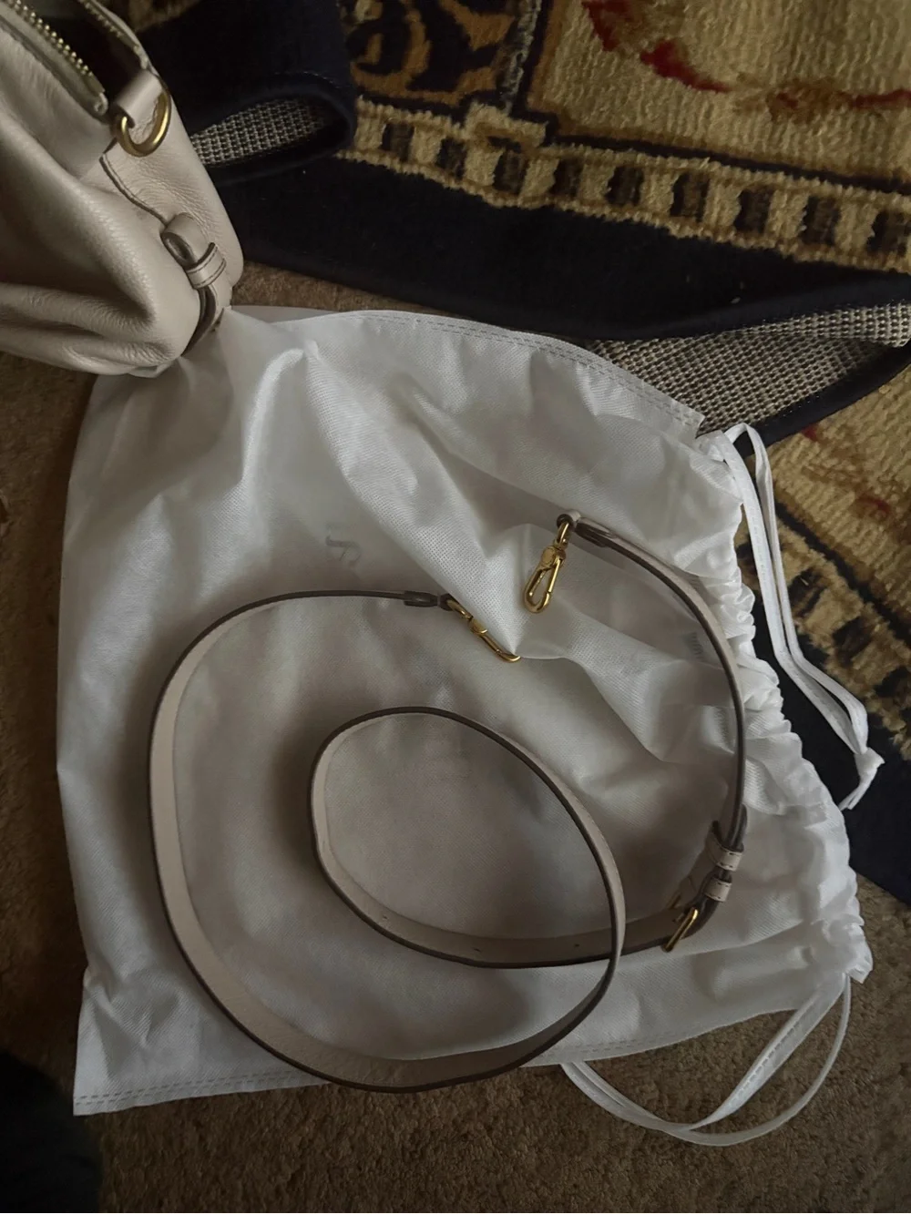 Marc by Marc Jacob’s Cream Leather crossbody  Handbag with Gold Plaque is 12 in